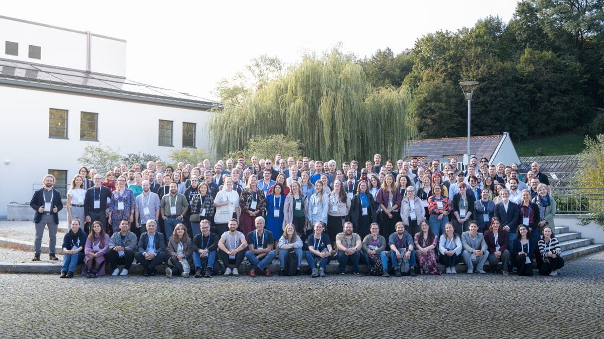 The TUC 2026 participants in front of the Universität Passau, softer light