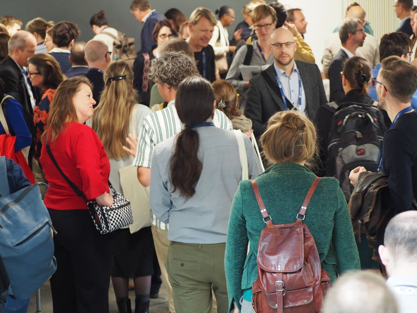 Attendees mingling in the hallway between sessions at TUC 2026