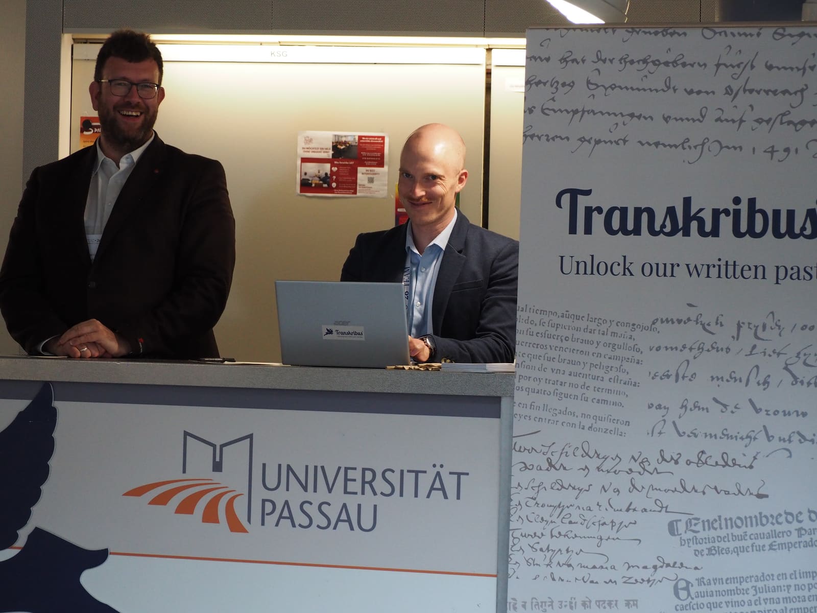 The welcome desk at the University of Passau with the Transkribus banner